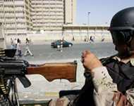 An Iraqi soldier takes position in Baghdad amid tight security