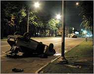 An overturned car lies on one ofNalchik's streets after the clash