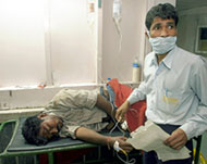 An orderly attends to a manat Ram Manohar Lohia Hospital 