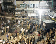 Police gather at the site in the Paharganj market in New Delhi