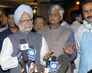 Manmohan Singh (L) blamed theblasts on terrorists