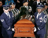 Pallbearers carry the casket ofParks into the Capitol Rotunda