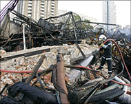Buildings were set ablaze in a10th night of violence