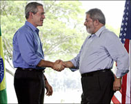 Bush (L) greeting Luiz Inacio Lulada Silva, the Brazilian president