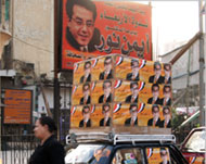 Posters urge voters to electal-Ghad Party's Ayman Nour