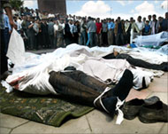 The bodies of those killed in theshooting piled up in the square 