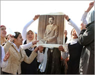 Women in Tikrit raise slogans inpraise of Saddam on Monday