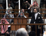 Saddam Hussein shouted at the court from the dock