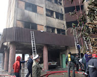 Iranian fire brigade workers at the scene of the aeroplane crash 