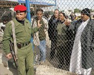 Palestinian travellers wait at the Rafah border crossing on Friday