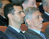 Khaddam(R) with al-Assad at theBaath party's congress last year