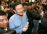 Thaksin (C) called snap elections three years ahead of schedule