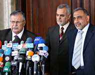 Talabani (L) speaks to the media with Abdul-Mahdi and al-Hashimi 