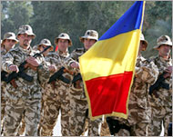 Romania has announced the death of its first soldier in Iraq 