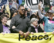 Reverend Jesse Jackson (2nd L) and Cindy Sheehan (R) at the rally 