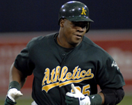 Oakland's Frank Thomas rounds the bases after his first home run