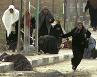 Palestinian women running for cover after Israelis fired at them 