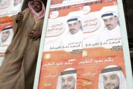 Campaign posters hang on the door of a shop in Manama. Bahrain