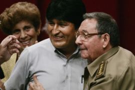 Raul Castro (R) chief of Cuba's army and brother of Cuba's President Fidel Castro, embraces Bolivian President Evo Morales (C)