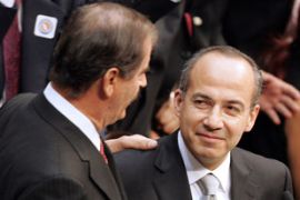 Vicente Fox greets Felipe Calderon