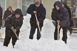 russian municipal workers clean snow