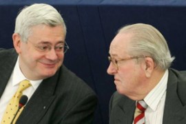 French far-right European Parliament member Bruno Gollnisch (L) talks with the leader of the French right-wing National Front Party Jean-Marie Le Pen at the European Parliament during a voting session on lifting Gollnisch's parliamentary immunity in Strasbourg France December 13 2005.