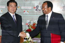 Hu Jintao, as China President, shakes hands with Paul Biya, as Cameroon