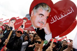 Lebanese demonstrators carry heart-shaped pictures of assassinated prime Minister Rafiq Hariri with the words "We miss you" during a ceremony to mark the second anniversary of Harir's death, 14 February 2007 in the heart of Beirut. Tens of thousands of people swarmed into Beirut to commemorate Hariri's murder two years ago, with tensions running high after deadly bus bombings.