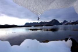 Iceberg melts in Kulusuk, Greenland, photo