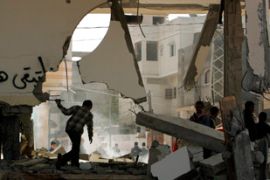 Palestinian boys inspect a destroyed office of the Fatah movement after clashes between Hamas and Fatah groups in the northern Gaza strip March 11, 2007