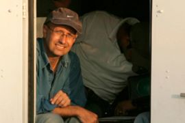 BBC's Gaza correspondent Alan Johnston sits inside an armoured car in the southern Gaza strip in this August 17, 2005