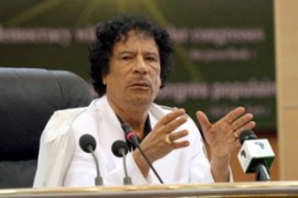 Libyan leader Moammar Gadhafi addresses a conference