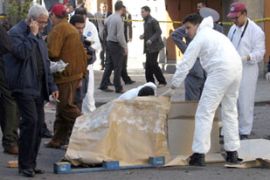 Forensic police examine suicide bombing site
