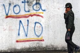 Ecuador policewoman referendum graffiti