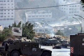 Israeli vehicles are seen in the northern Palestinian city of Nablus in the Israeli occupied West Bank
