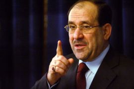 al-Maliki looking stern