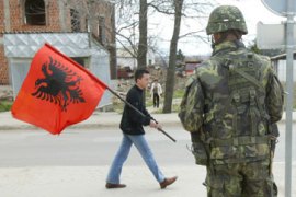 Kosovo youth with flag