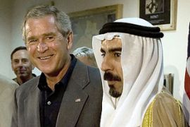 Bush shaking hands with Iraqi Sunni sheikh Sattar Abu Reesha
