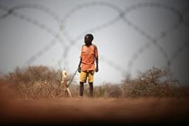 Djabal, Chad, a child waits near a military line of Goz Beida, a French military camp