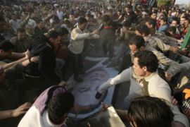 protesters trample poster hosni mubarak egypt