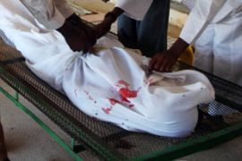 Somalis prepare the bosy of a man killed in Mogadishu