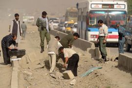 Afghan investigators at bomb site