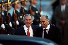 President George W. Bush (L), is welcomed by Slovenian Prime Minister Janez Jansa