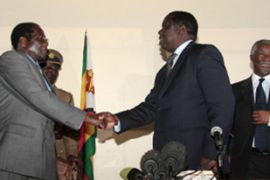 Mugabe and Tsvangirai shaking hands