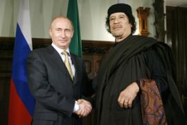vladimir putin and muammar gaddafi (moscow)