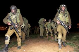 Israeli infantry soldiers marching into the Gaza Strip