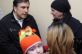 Georgia''s President Mikheil Saakashvili speaks as he visits a medical center in Tbilisi