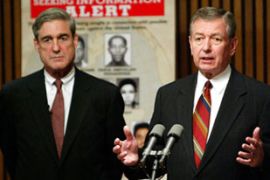 John Ashcroft, former attorney general, and Robert Mueller, FBI director