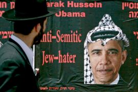 Israeli Jew looks at poster of Obama
