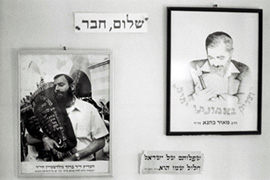Pictures of Baruch Goldstein, left, and Rabbi Kahane at a house in Hebron [Ilan Mizrahi]